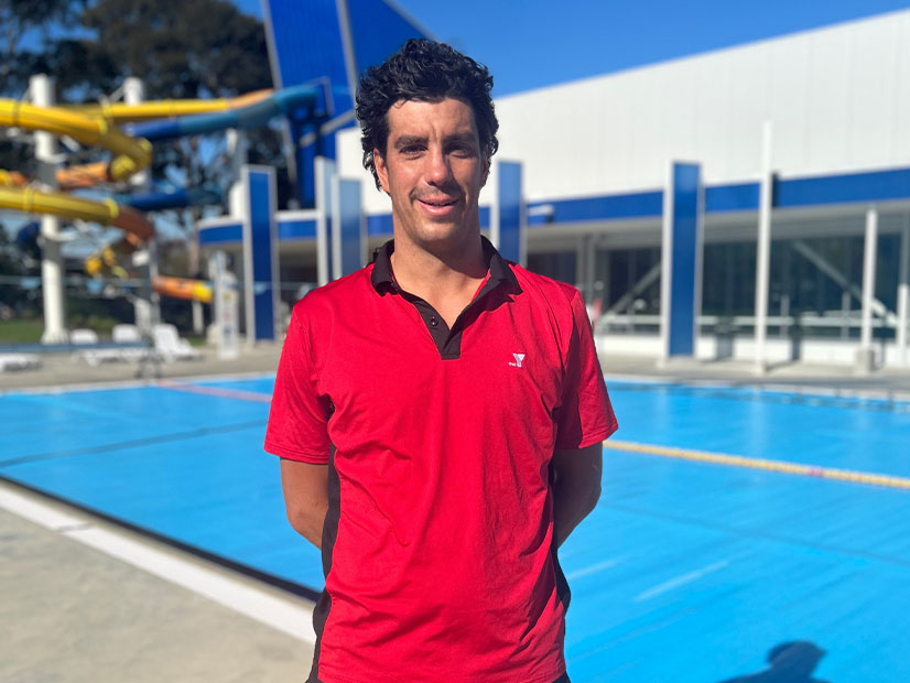 Andrew Cozier in front of outdoor swimming pool