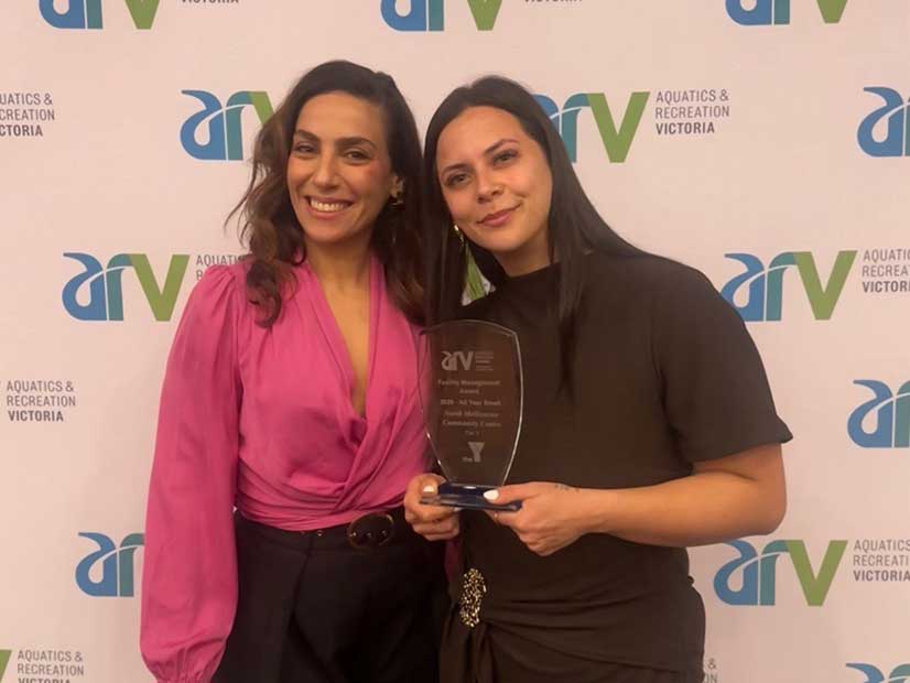 Two winners posing with their ARV Award