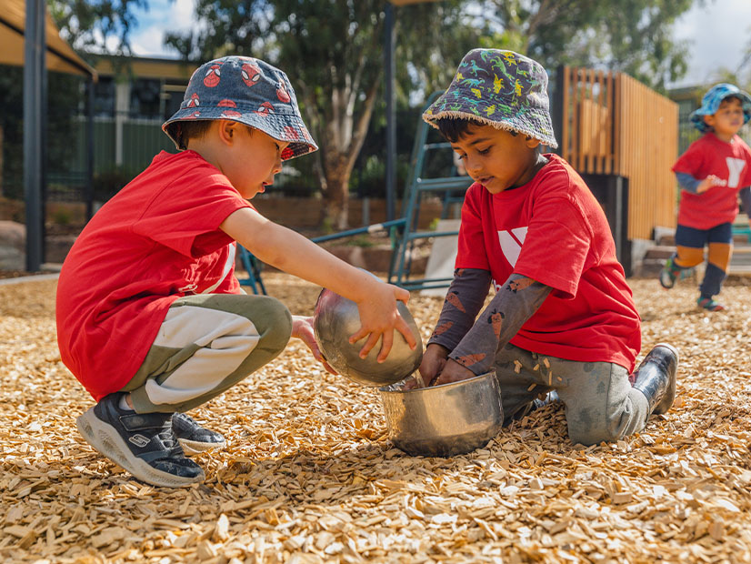 Young children playing on new Derrimut ELC outdoor playground