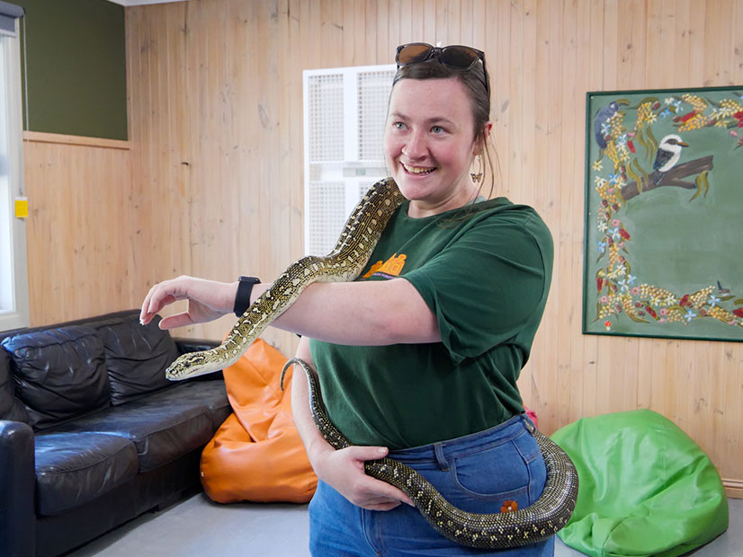 Woman holding snake