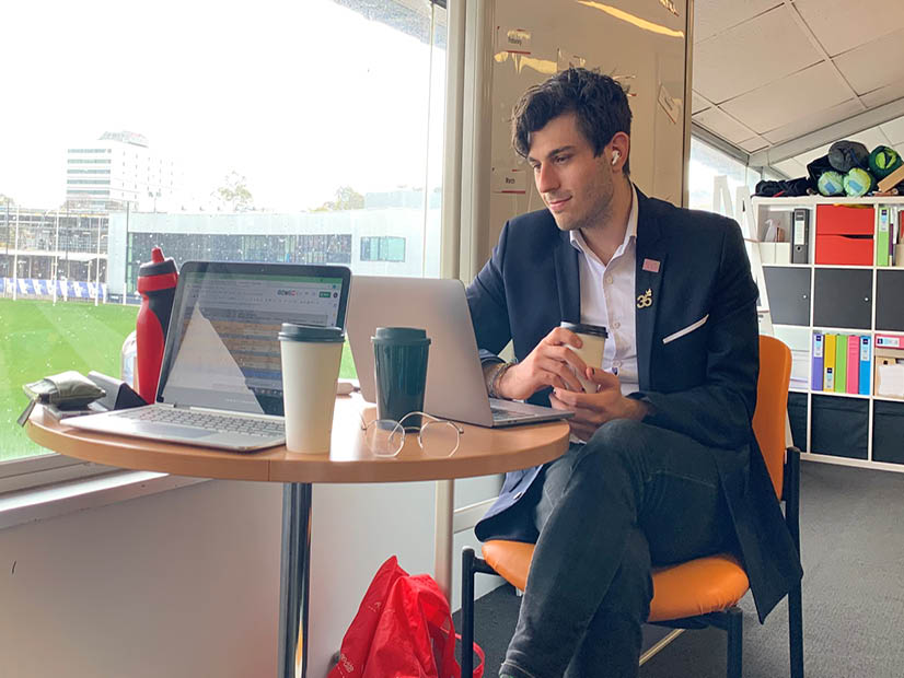 YMCA Program Director, Kergen Angel watching the YMCA Youth Parliament debate from the YMCA office.